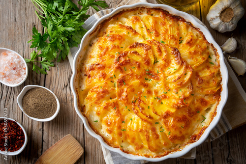 Photography Potato gratin - graten (baked potatoes with cream and cheese)