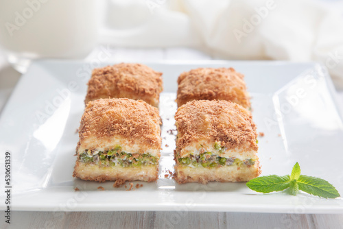 Traditional turkish new dessert cold milky baklava with pistachio (Turkish name; soguk baklava)