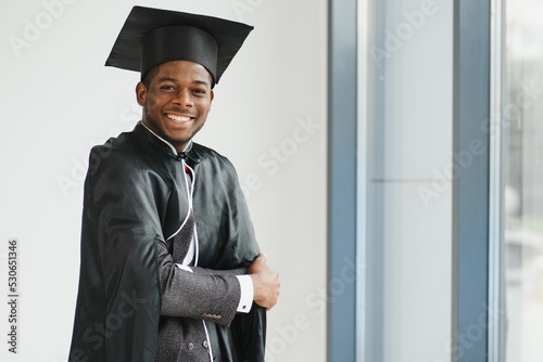 happy african american law school graduate on graduation day