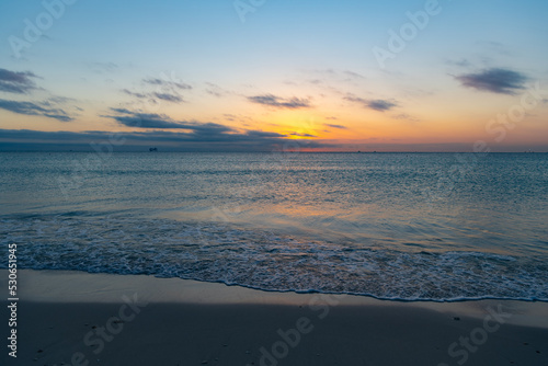 romantic view on sunset with sea water on the summer beach