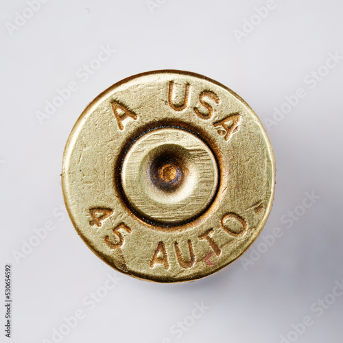 Obraz na plátne Pistol bullet casings on white background, top view