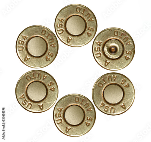 Foto Pistol bullet casings on white background, top view