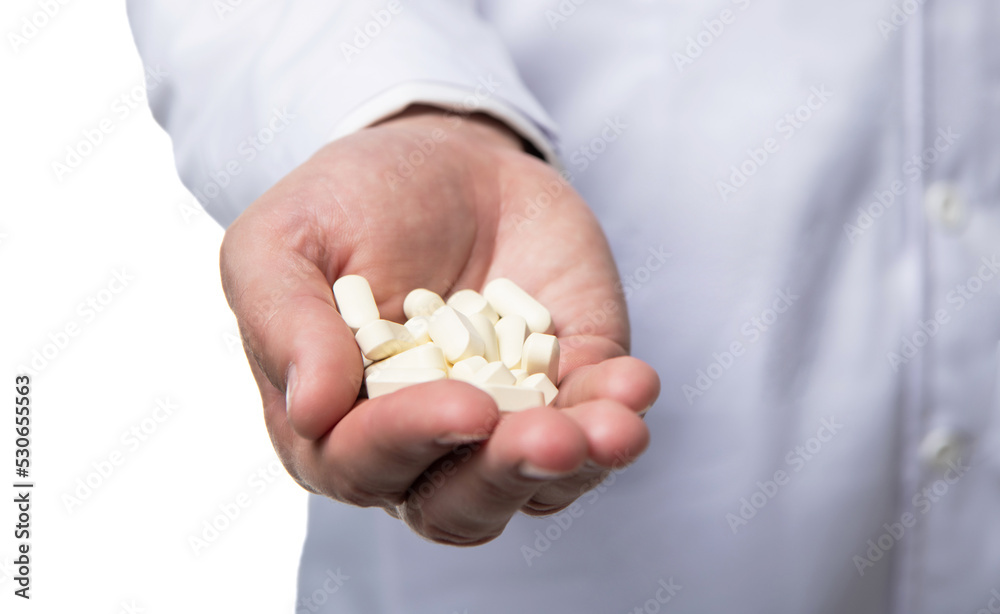 multivitamins pills closeup. multivitamins and medications. hands hold multivitamins multivitamins pills closeup. multivitamins and medications. hands hold multivitamins
