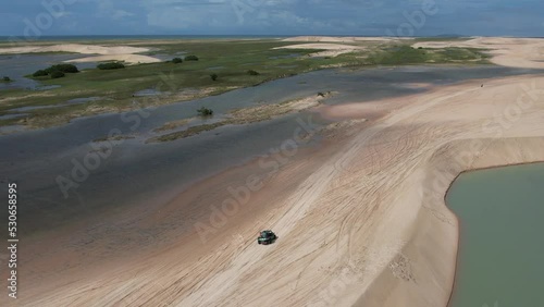 4x4 cars through the dunes of Jericoacoara in Brazil photo