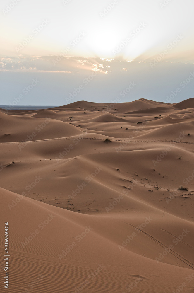 Dunes in the Sahara desert at sunset, the desert near the town of Merzouga, a beautiful African landscape