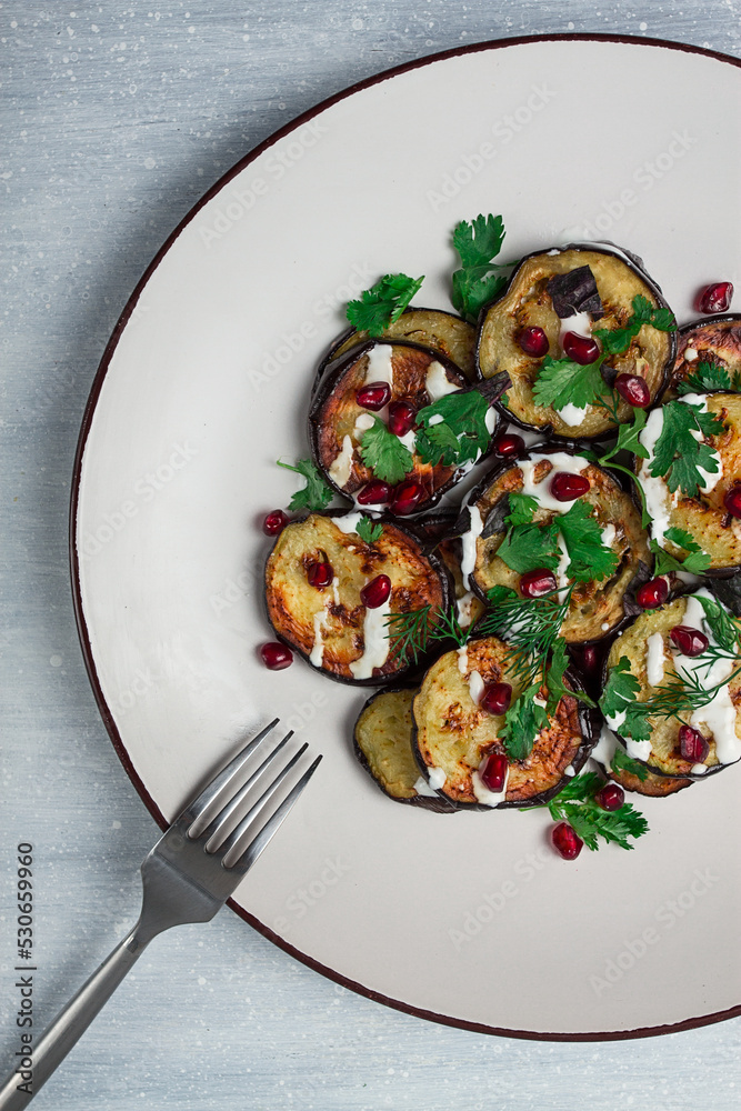 Fried eggplant, with white sauce, pomegranate seeds, top view, no people,