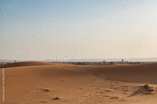 Dunes in the Sahara desert at sunset  the desert near the town of Merzouga  a beautiful African landscape