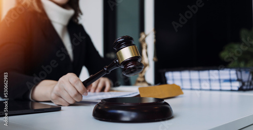 Male lawyer working with contract papers and wooden gavel on tabel in courtroom. justice and law ,attorney, court judge, concept.