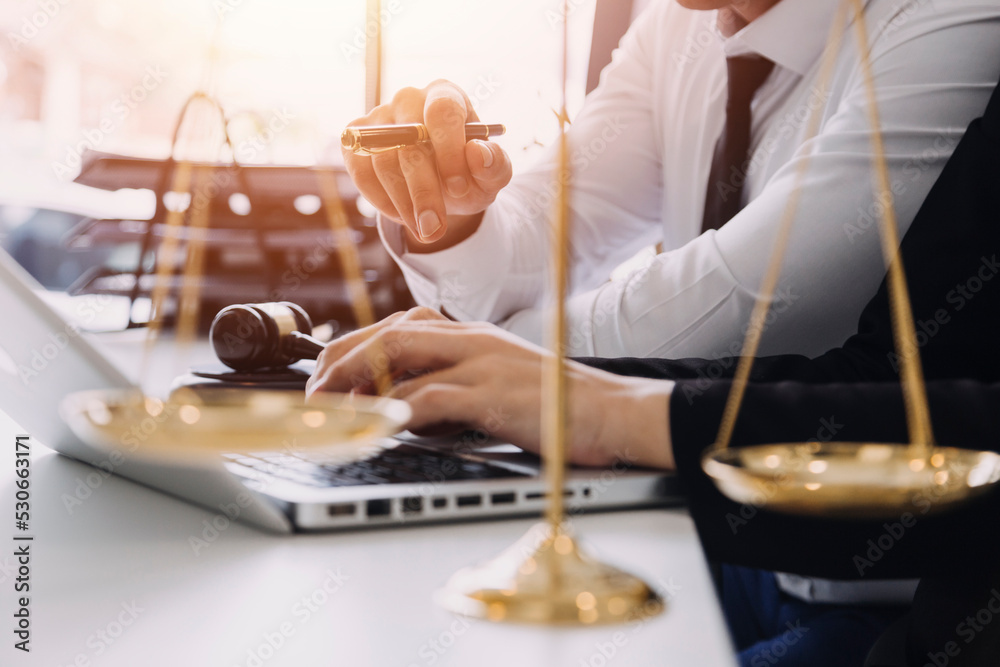 Fototapeta premium Male lawyer working with contract papers and wooden gavel on tabel in courtroom. justice and law ,attorney, court judge, concept.