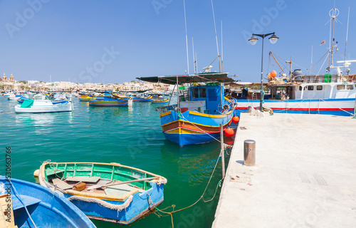 Colorful fishing boats are moored in Marsaxlokk harbor