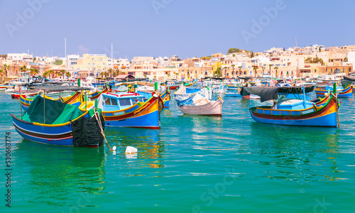 Fototapeta Naklejka Na Ścianę i Meble -  Colorful traditional Maltese fishing boats. Marsaxlokk, Malta