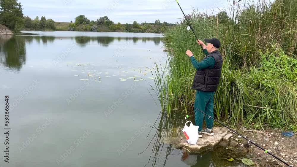 Man fishing on the river in the morning