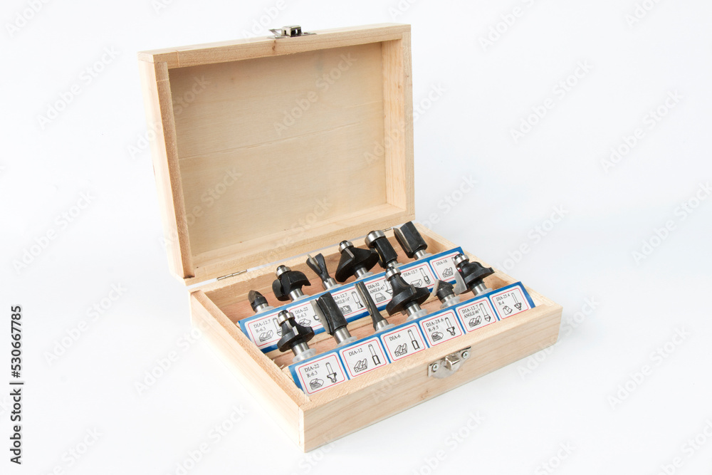 a set of milling cutters for processing wooden products with a joiner's hand power tool, on a white background a set of milling cutters for processing wooden products with a joiner's hand power tool, on a white background