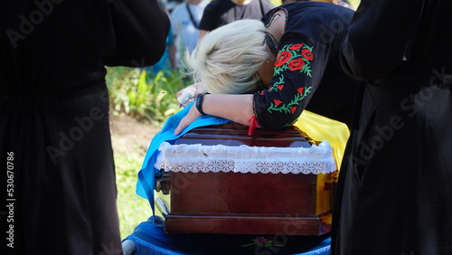 Ukraine. War. The funeral of Ukrainian soldiers who died during the Russian invasion of Ukraine. Coffin decorated with flowers. The funeral ceremony of a soldier. Funeral ceremony.