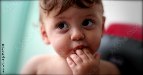 Adorable baby infant child face in highchair