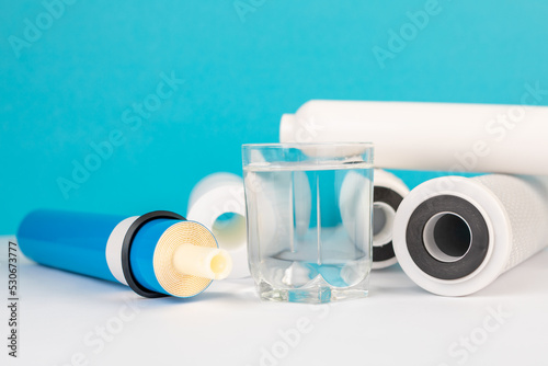 filter cartridges for water on a bright blue background.