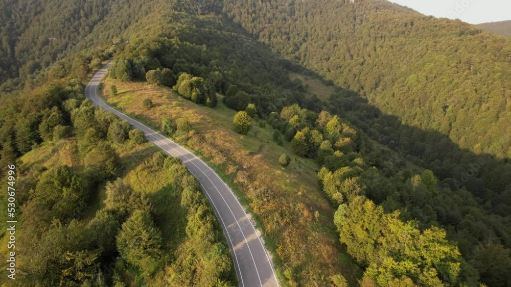car drive on mountain range road drone aerial view car drive on mountain range road drone aerial view