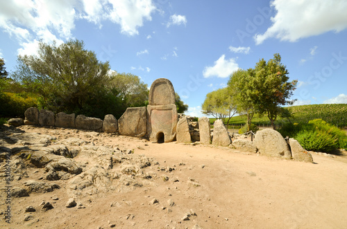 Giants' grave of Coddu Vecchiu, a Nuragic funerary monument located near Arzachena in northern Sardinia, dating from the Bronze Age. photo