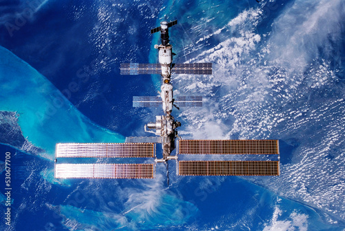 Fototapeta Naklejka Na Ścianę i Meble -  International space station over the planet. Elements of this image furnished by NASA