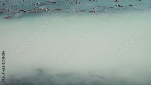 Hydrogen sulfide stagnant salt marsh. Gas turns turbid-blue in water on light. All living things die in such an environment. Probably piles of sand made polychaete worms, now mass dying