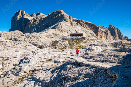 Frau wandert auf der Pala Hochfläche photo