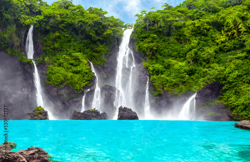 Fototapeta Naklejka Na Ścianę i Meble -  Beautiful waterfall with sunlight in jungle, paradise fantasy island. 3D Illustration