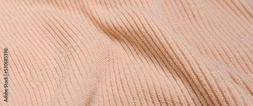Texture of soft knitted fabric, closeup