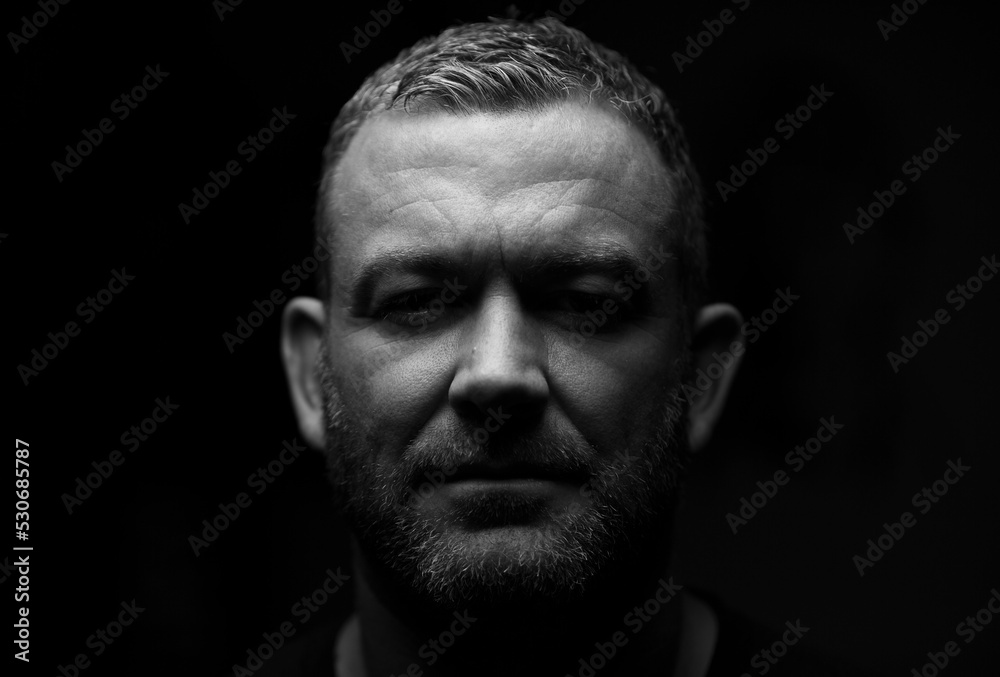 Close up of male looking into camera with a stare. Close up of male looking into camera with a stare.