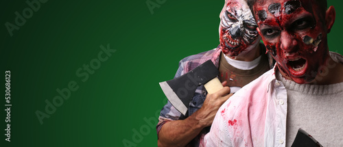 Scary zombie men on dark gr...