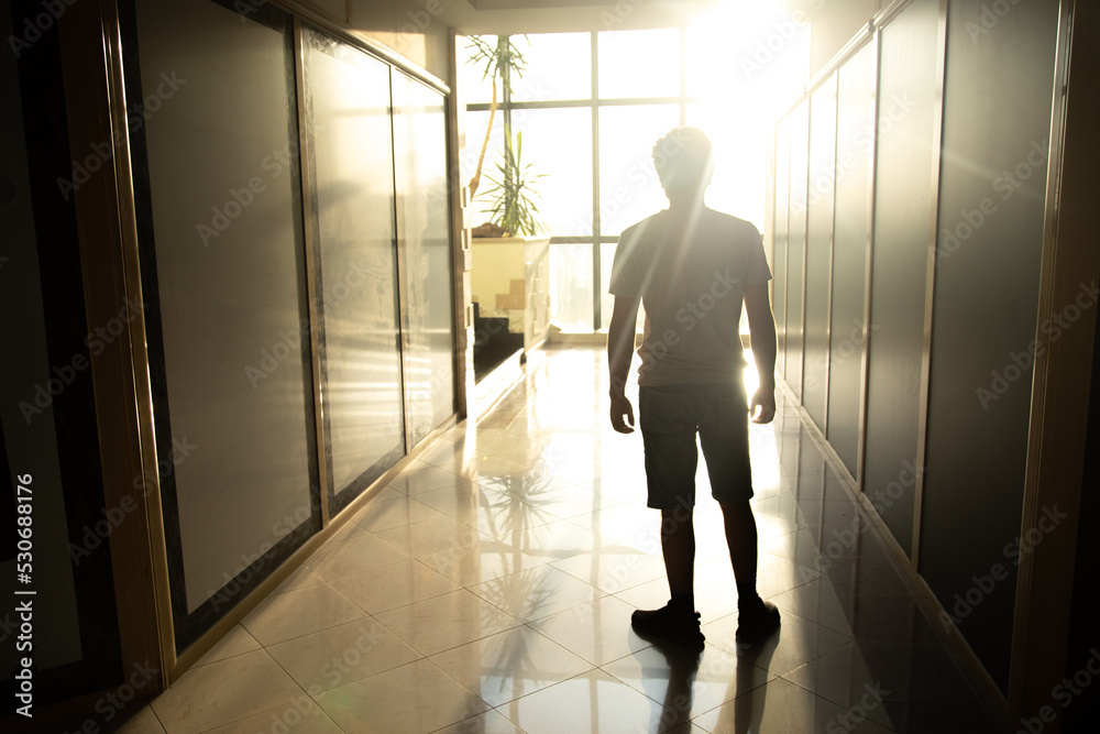 A man walks down the corridor. A man walks down the corridor.
