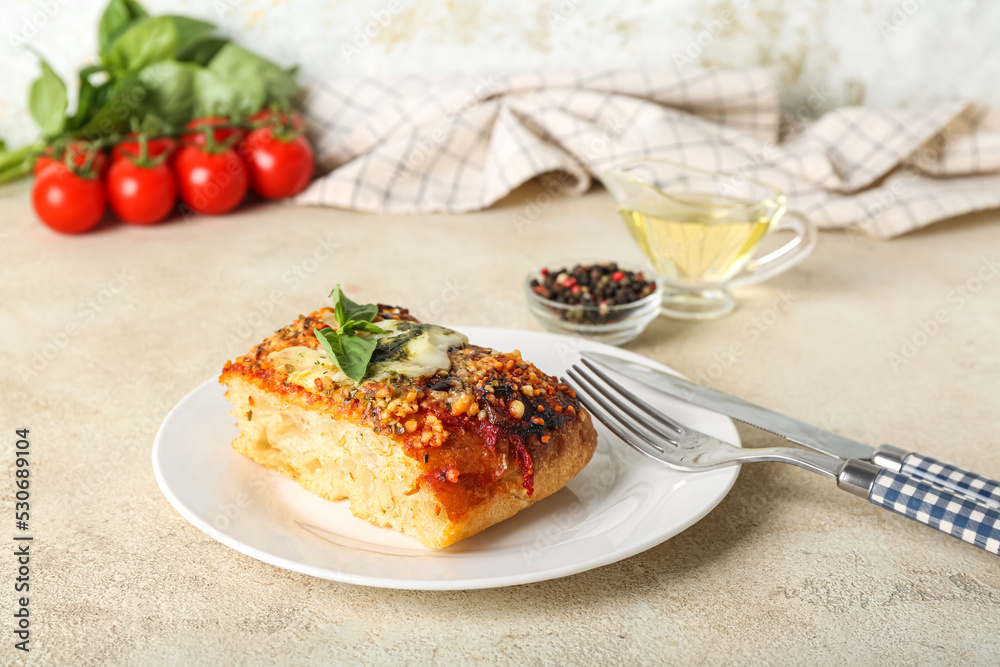 Plate with piece of Italian pie on light background Plate with piece of Italian pie on light background
