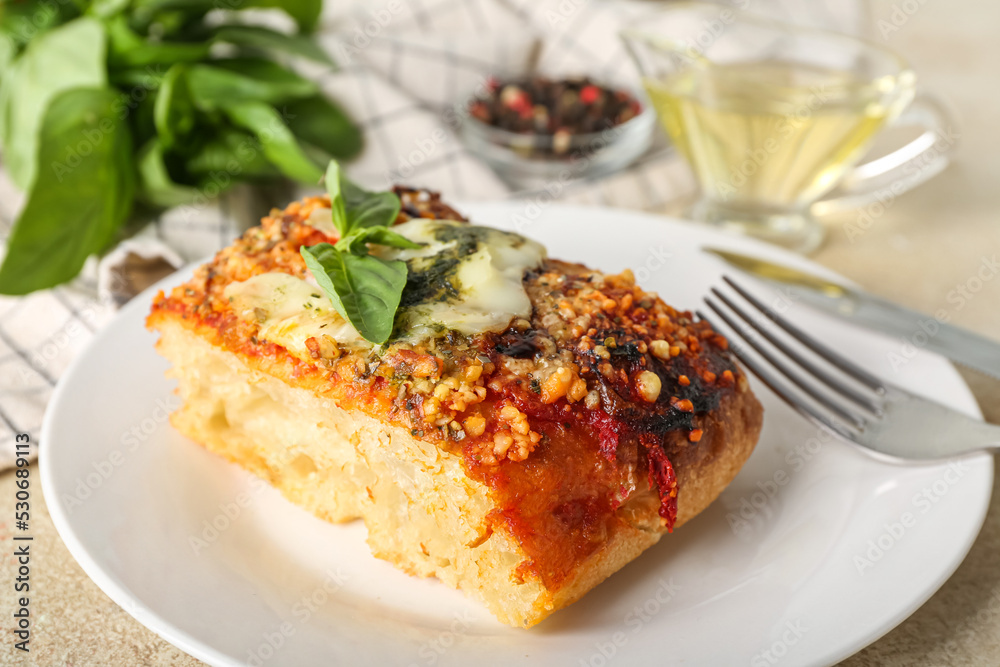 Plate with piece of Italian pie on table, closeup