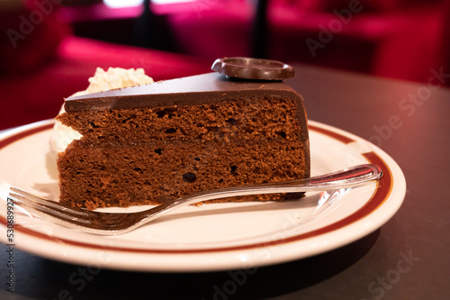 Canvas Print Piece of famous Sachertorte chocolate cake with apricot jam of Austrian origin s