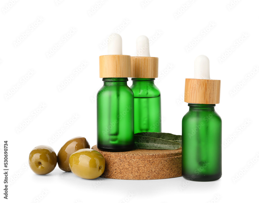Bottles of essential olive oil isolated on white background