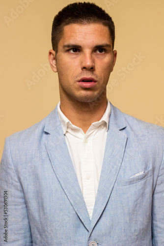 Portrait of handsome young man in suit