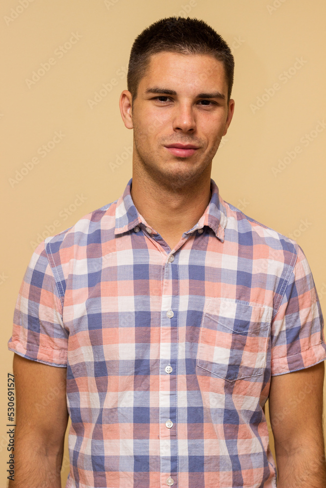 Fototapeta premium Portrait of handsome young man in casual shirt