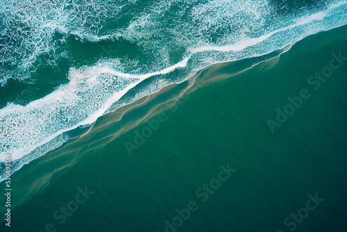 Turquoise waves in ocean. Breaking wave with sun light