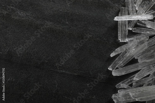 Menthol crystals on grey background, flat lay. Space for text