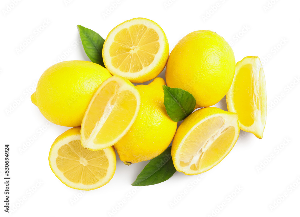 Cut and whole ripe lemons with green leaves on white background, top view Cut and whole ripe lemons with green leaves on white background, top view