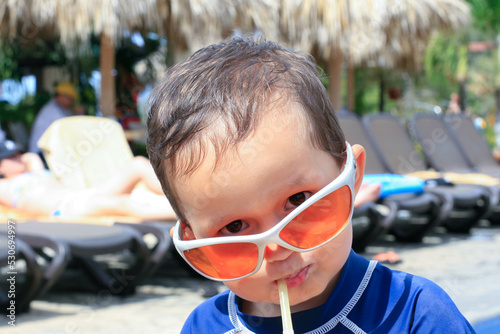 Child with  Orange sunglasses