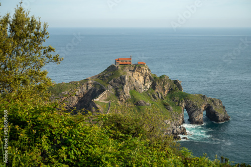 Stone footpath to famous landmark and film location in North of Spain, ocean islet with chapel San juan de gaztelugatxe, Basque Country, Spain