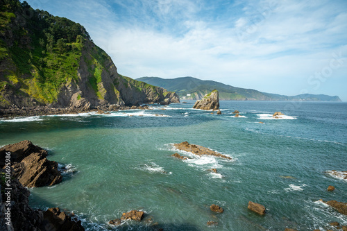 Stone footpath to famous landmark and film location in North of Spain, ocean islet with chapel San juan de gaztelugatxe, Basque Country, Spain