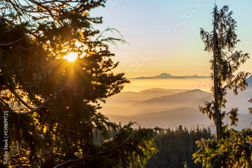 dramatic sunrise overlooking San Juan strait and the mountains beyond as viewed from Hurricane Ridge in Olympic national park. photo