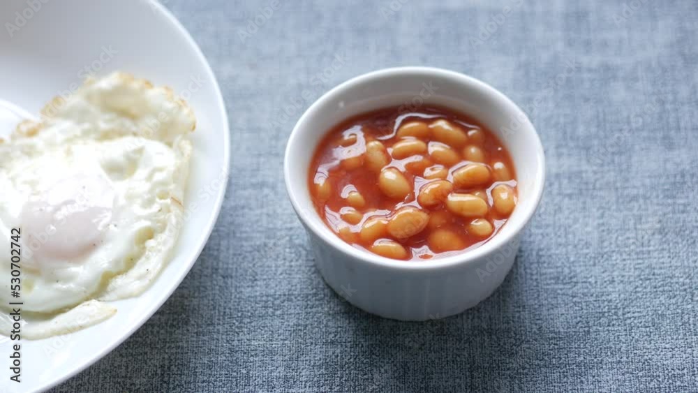 Tasty baked beans, egg and bread for morning break fast Tasty baked beans, egg and bread for morning break fast
