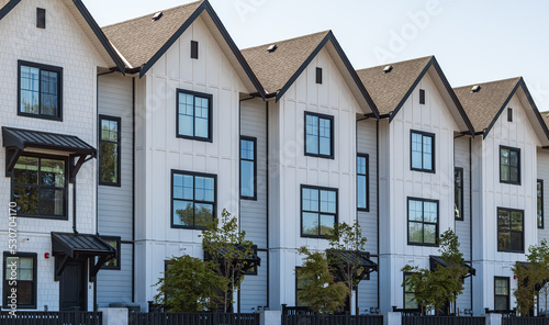 Brand new apartment building on sunny day in BC, Canada. Architectural details of modern apartment building photo