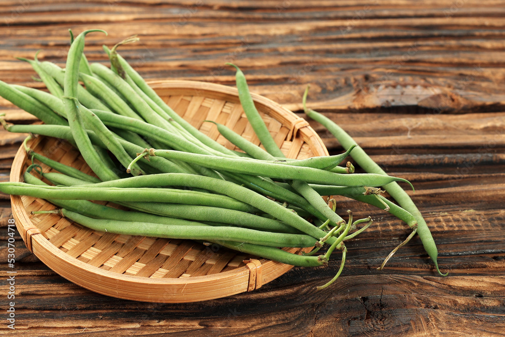 French Green Bean or Buncis on Bamboo Plate, Preparation Cooking Vegetarian Food. French Green Bean or Buncis on Bamboo Plate, Preparation Cooking Vegetarian Food.
