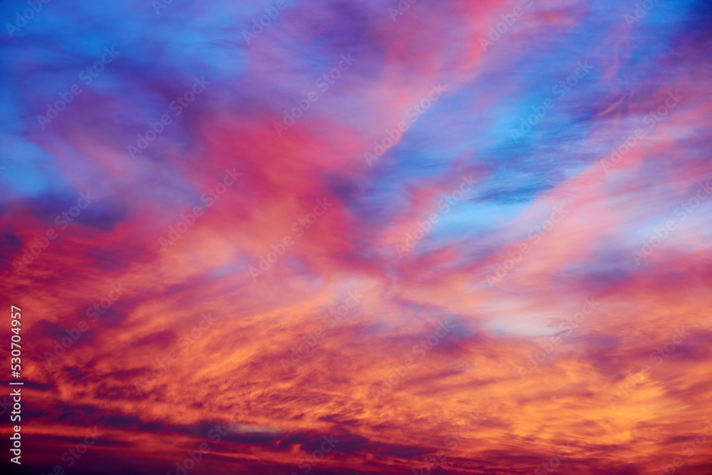 Dramatic pink and blue sunset sky with clouds. Abstract nature backgrounds