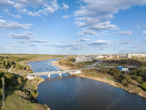 Beauriful sunset view along the Iset river and rocks in town Kamensk-Uralskiy. A scenic sunset at the river. Kamensk-Uralskiy, Sverdlovsk region, Ural mountains, Russia. Aerial view photo