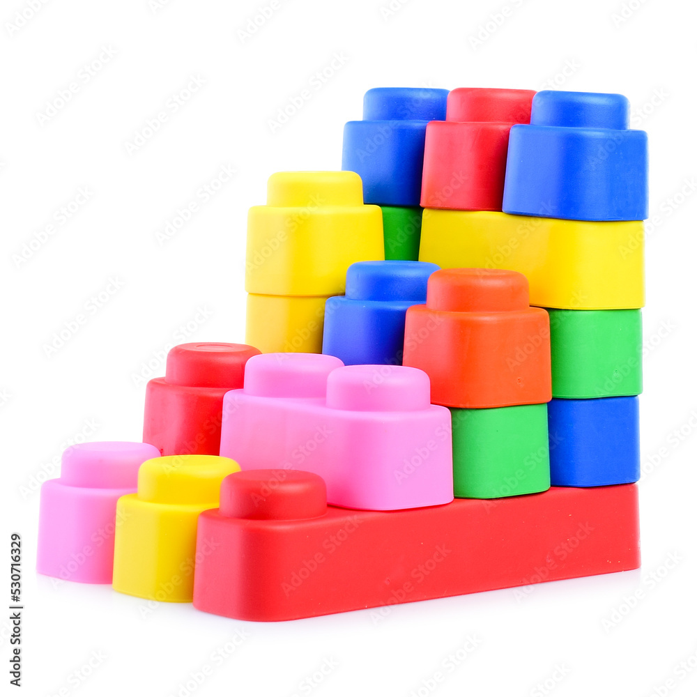Multi-colored plastic children's construction kit, isolated on a white background. Design and modeling. Development of children's motor skills and thinking. Building different models Multi-colored plastic children's construction kit, isolated on a white background. Design and modeling. Development of children's motor skills and thinking. Building different models