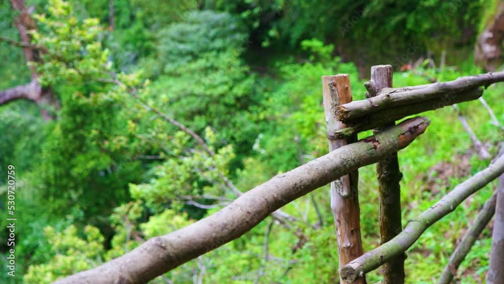 A Fence Made From Wood That Divide Between Footpath and Cliff A Fence Made From Wood That Divide Between Footpath and Cliff